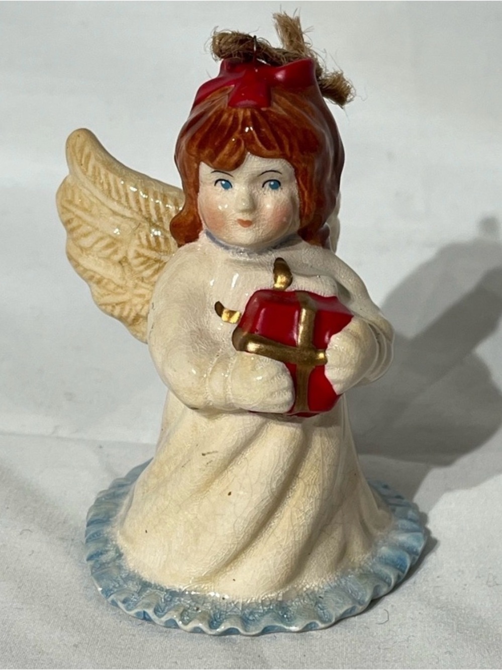 Vintage Hand Painted Porcelain Christmas Angel Cherub Ornament Holding a Gift